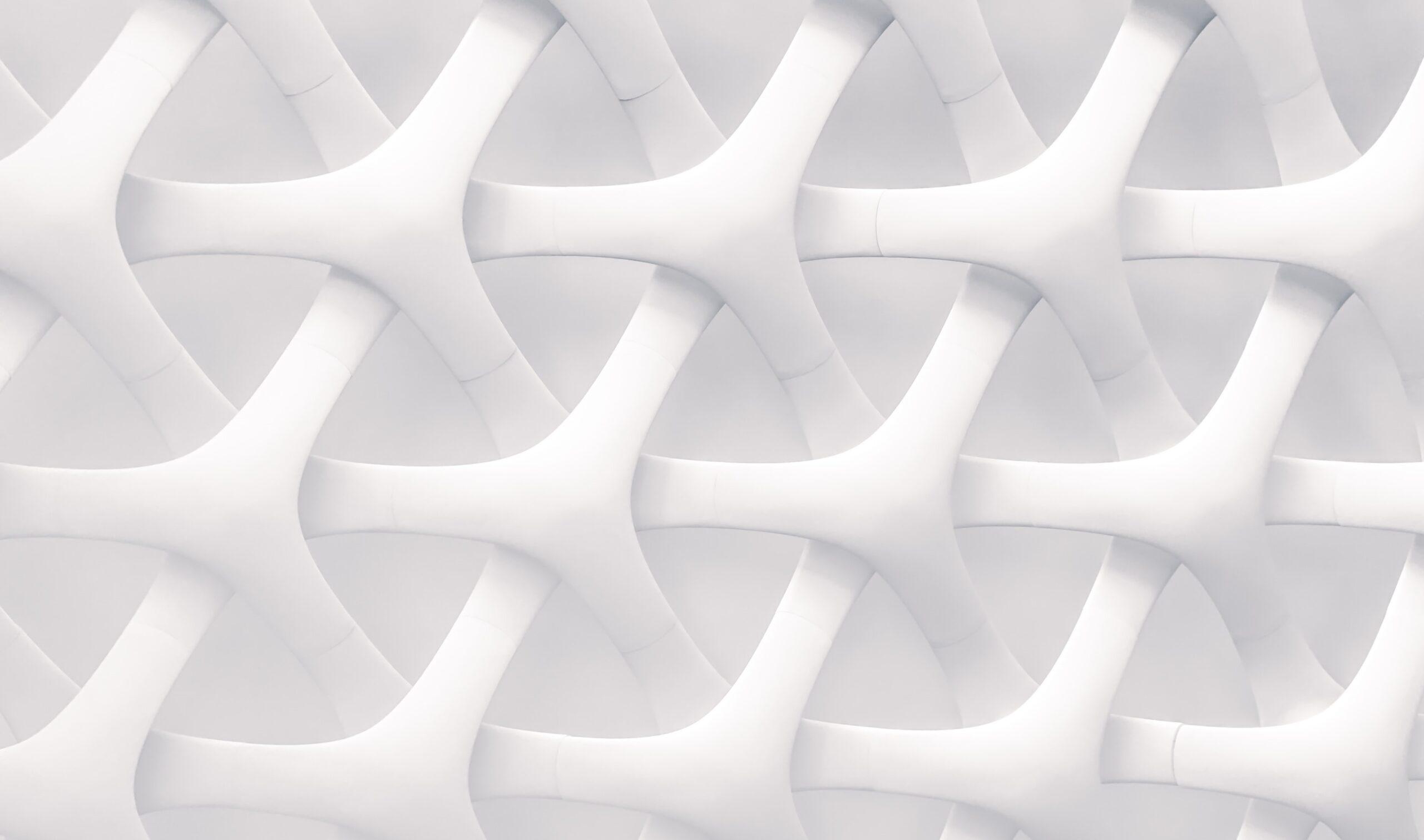 White image of shapes interwoven as part of an article about the link between branding and design.