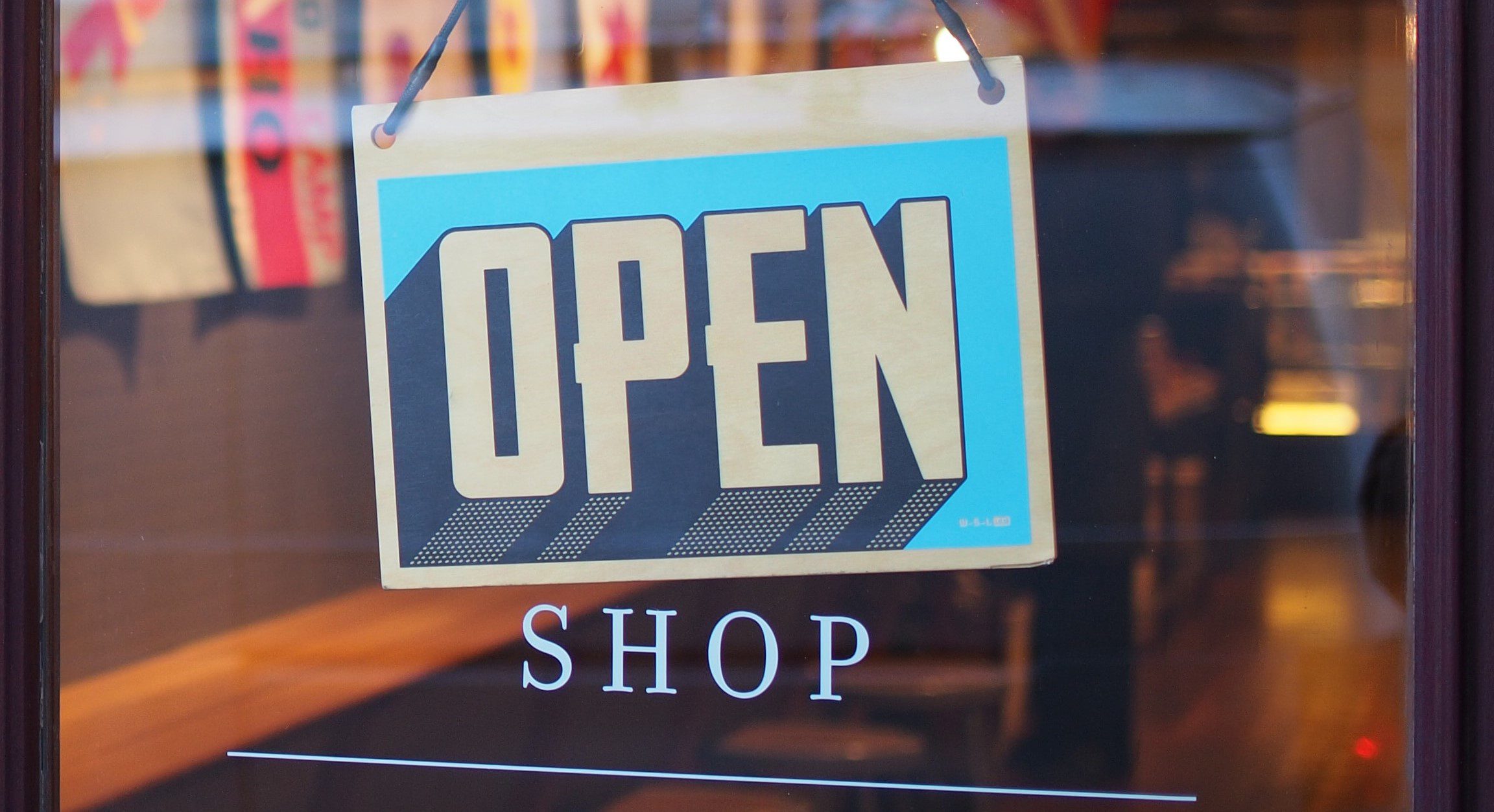 Shopfront displaying an 'Open' sign.