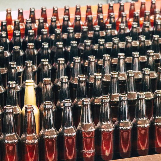 Rows of glass soft drink bottles.