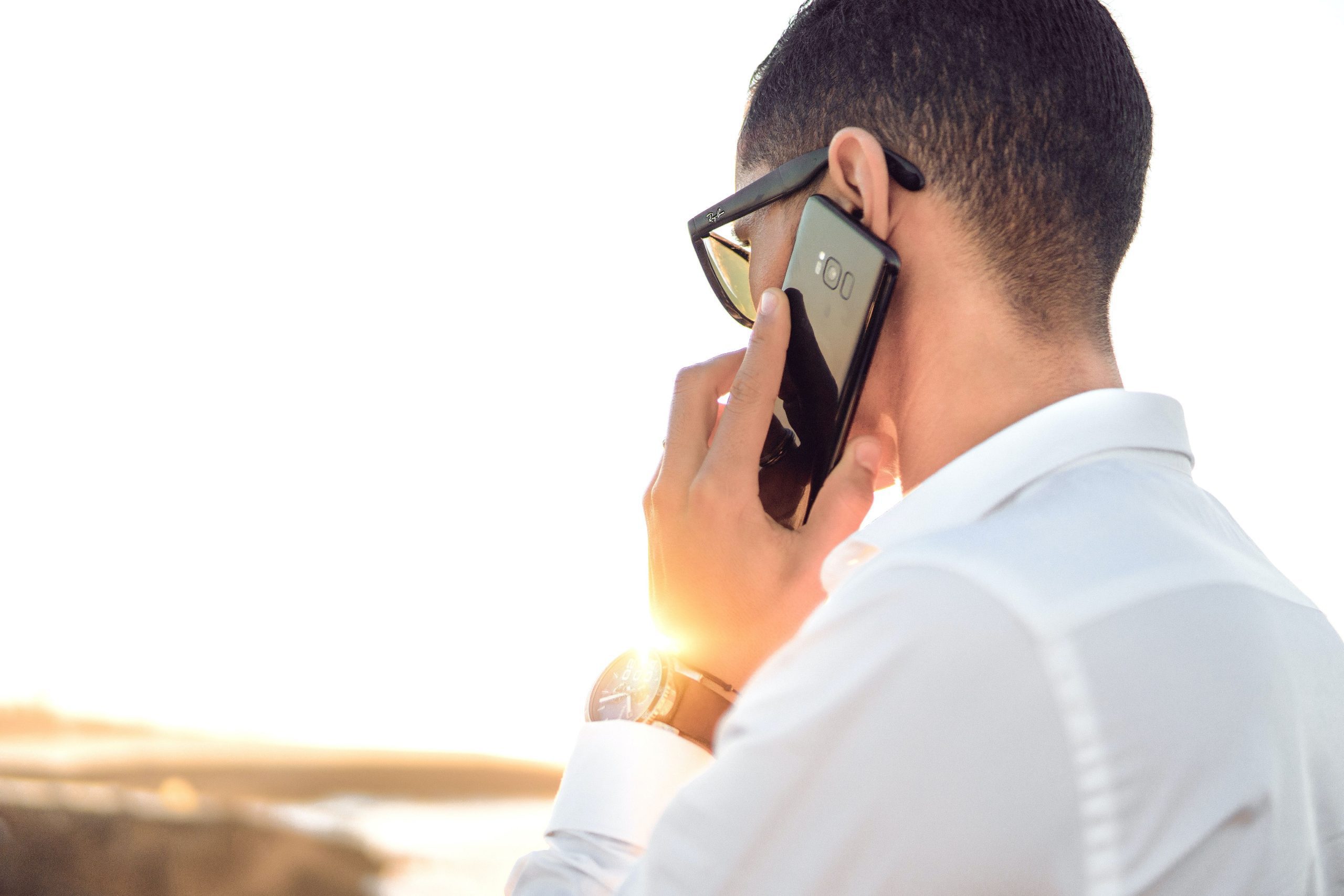 Man talking outside on mobile phone.