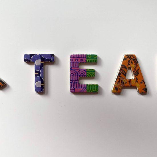 Colourful letters arranged to spell out 'A team' as part of an article about marketing agencies.