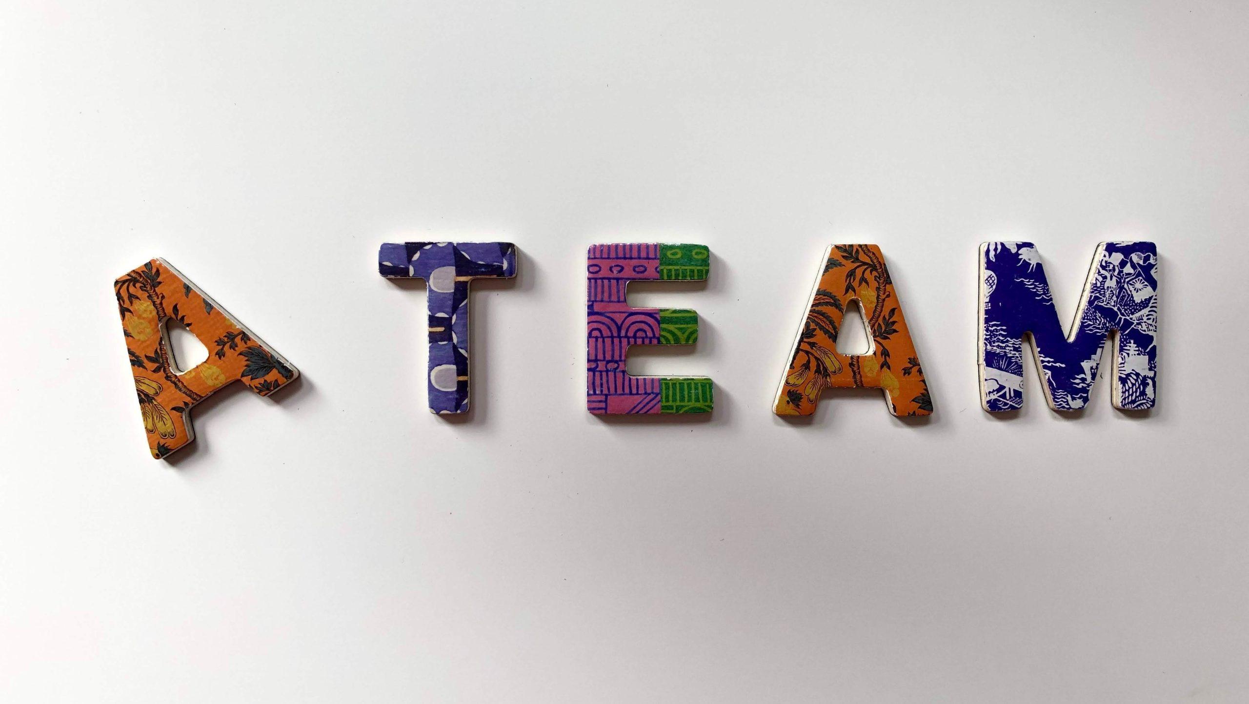 Colourful letters arranged to spell out 'A team' as part of an article about marketing agencies.