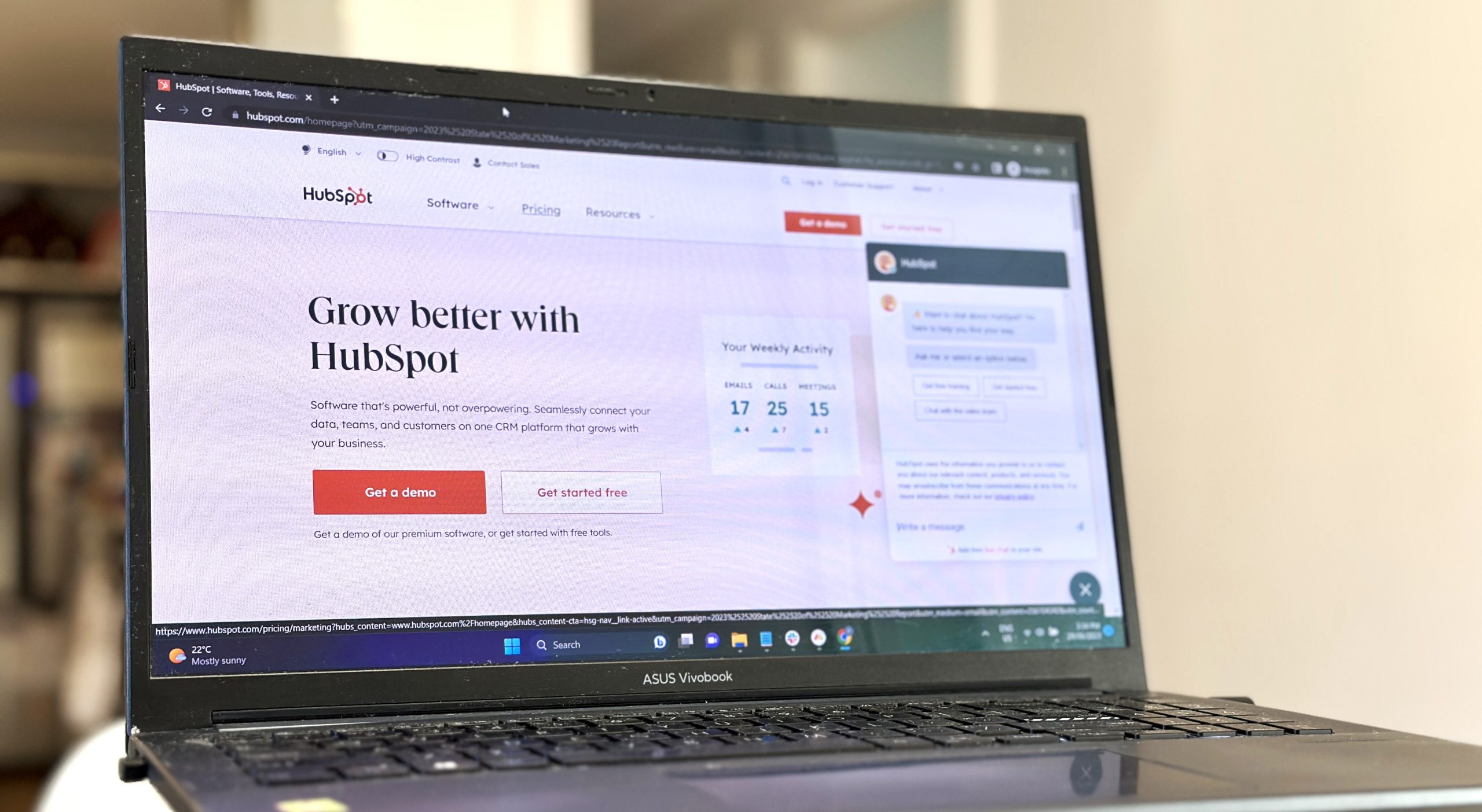 Laptop showing Hubspot homepage as part of an article about why your CRM can run your business.