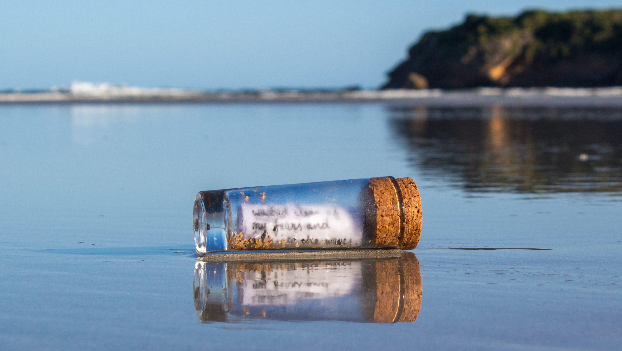 Message in a bottle washed up on a beach.
