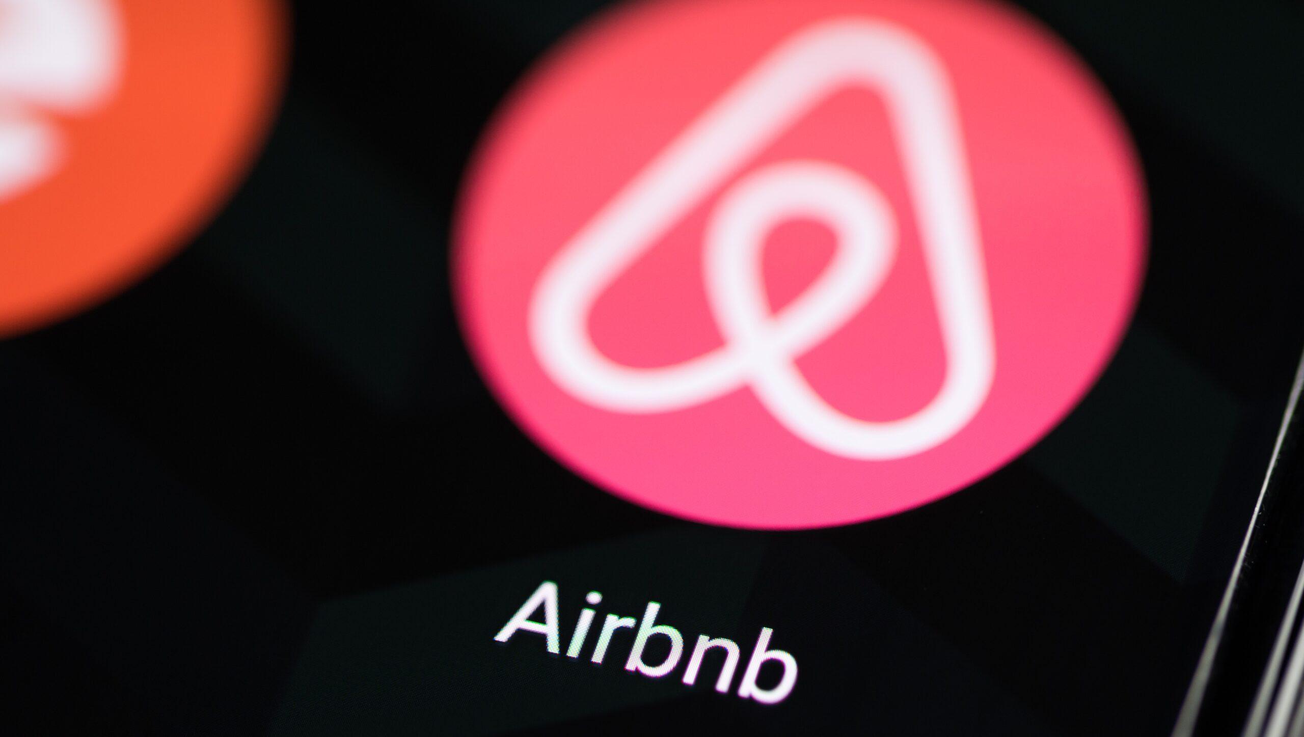 Airbnb logo displayed on a smartphone screen.