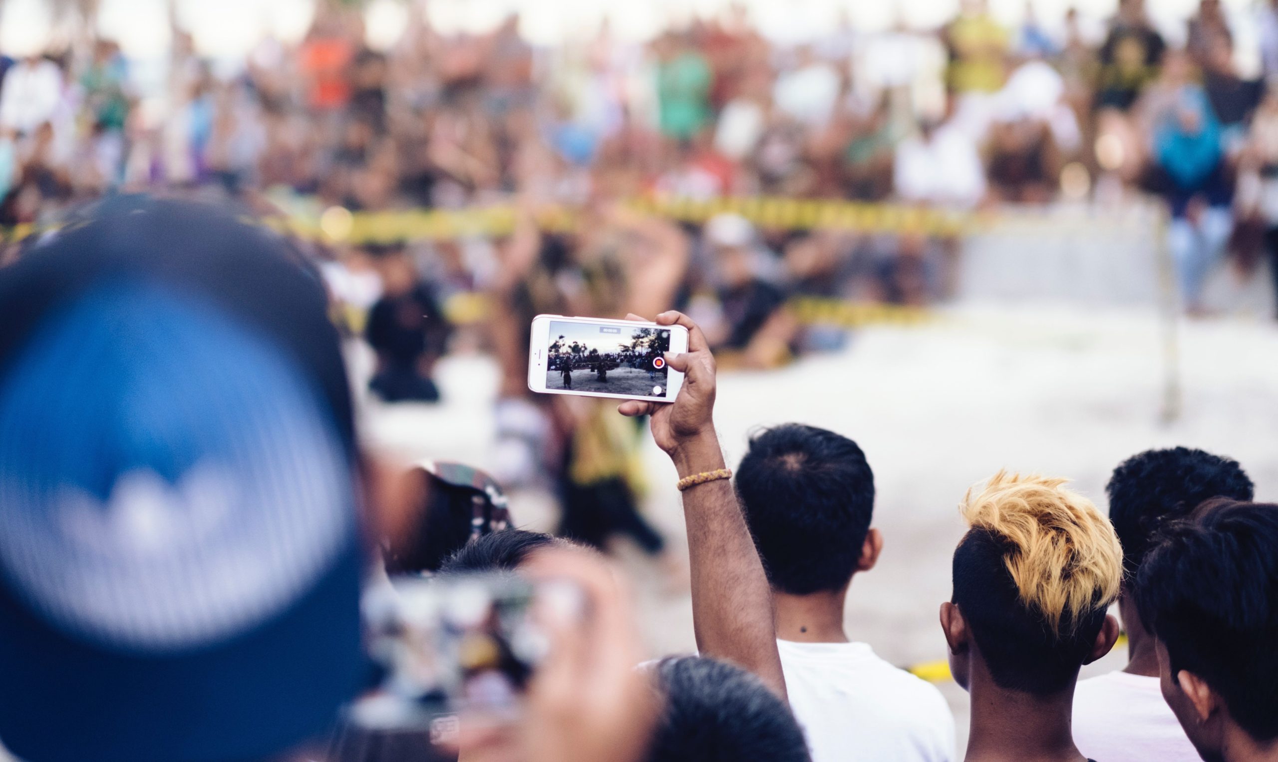 Someone recording an undisclosed event on their smartphone.