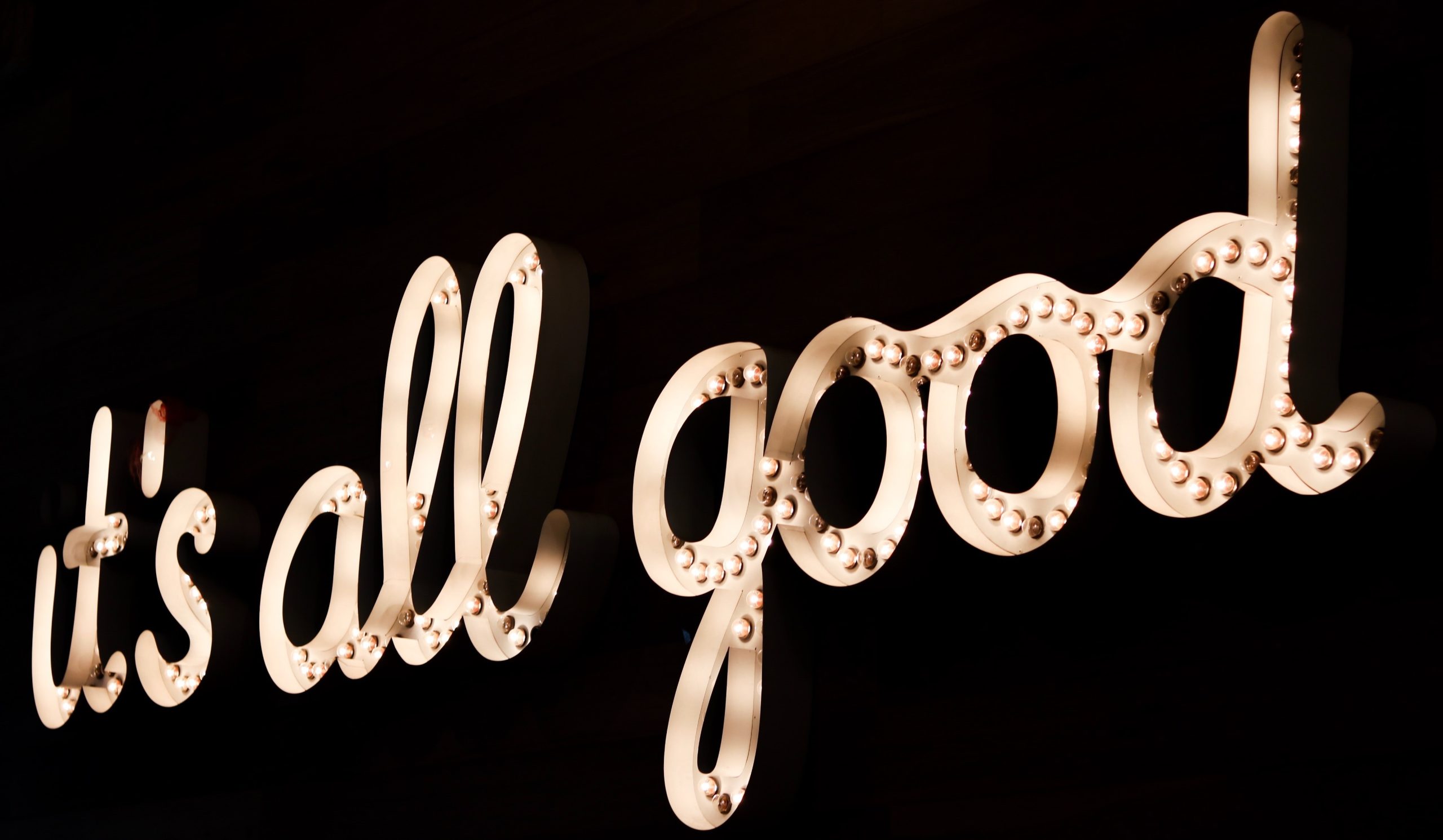 Neon sign with the words, 'it's all good'.