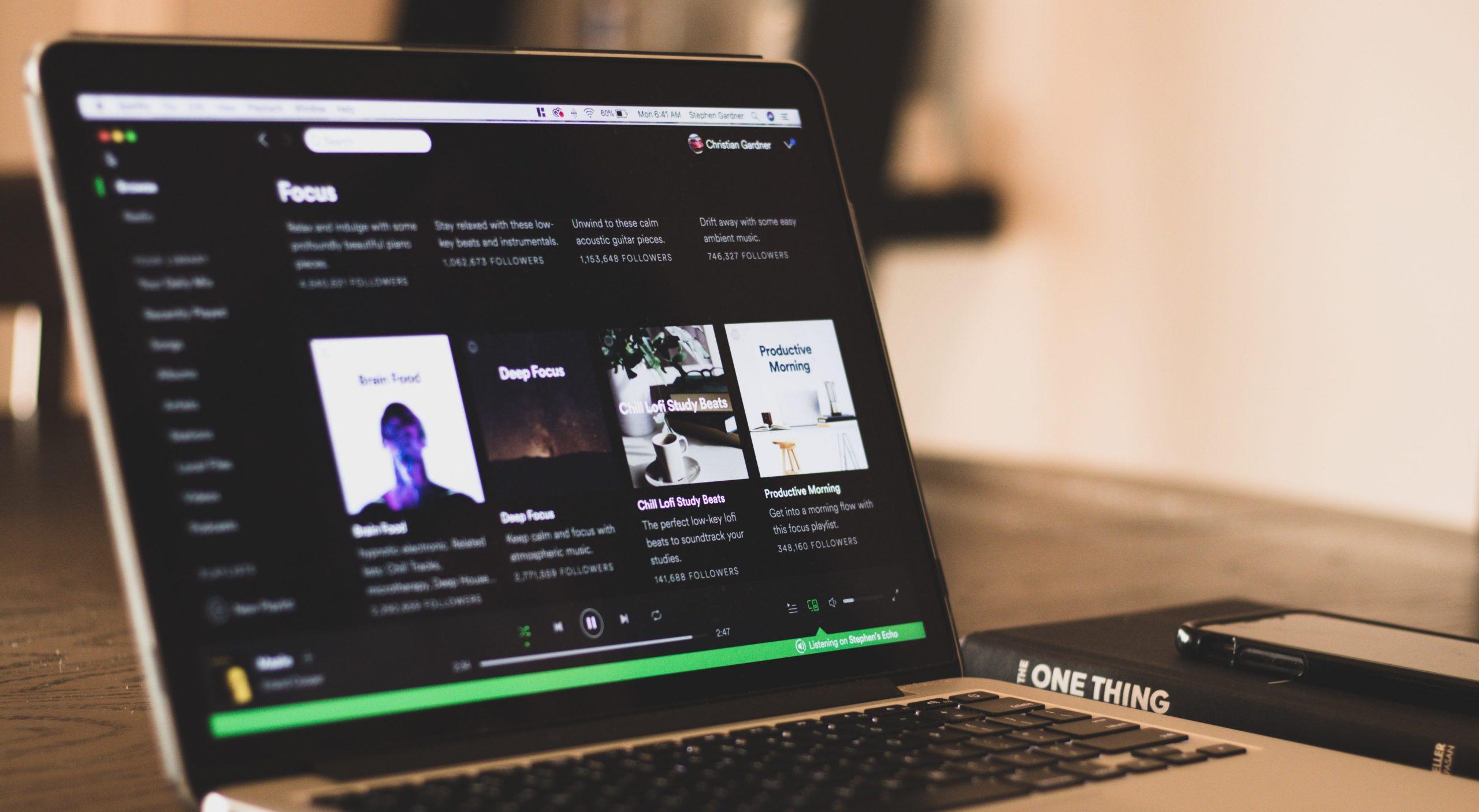 Laptop displaying a Spotify page.