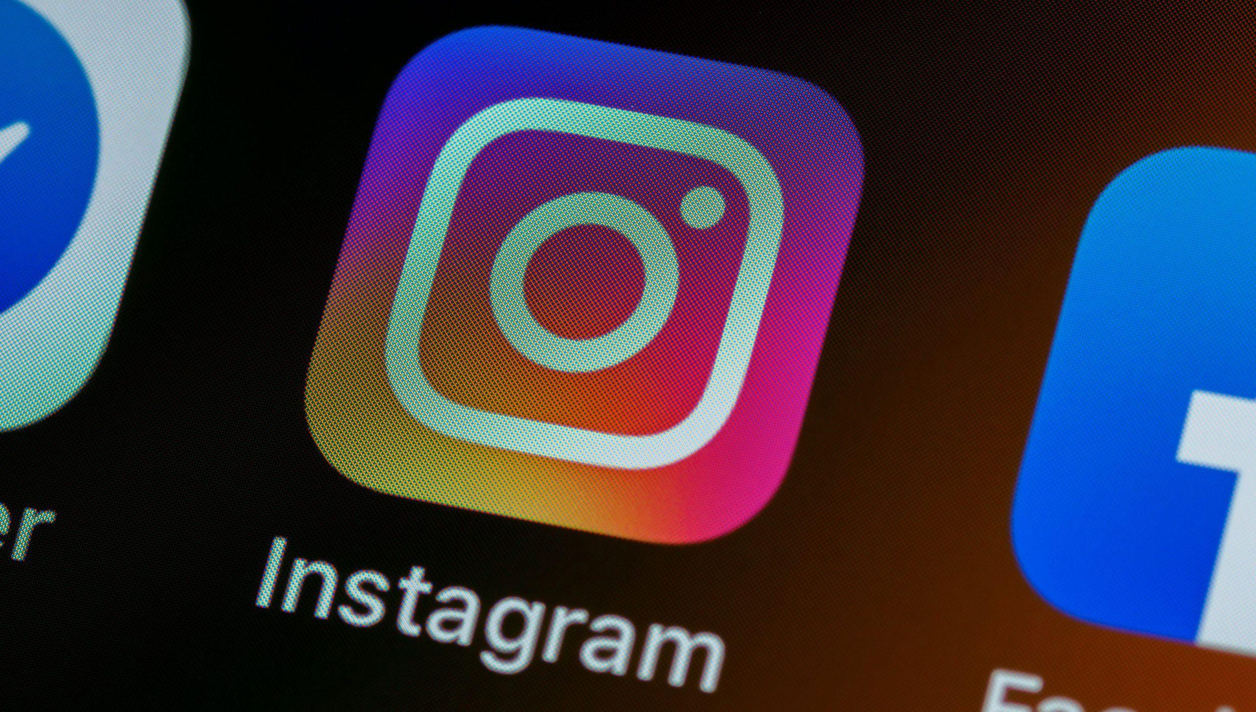 Instagram logo displayed on a smartphone.