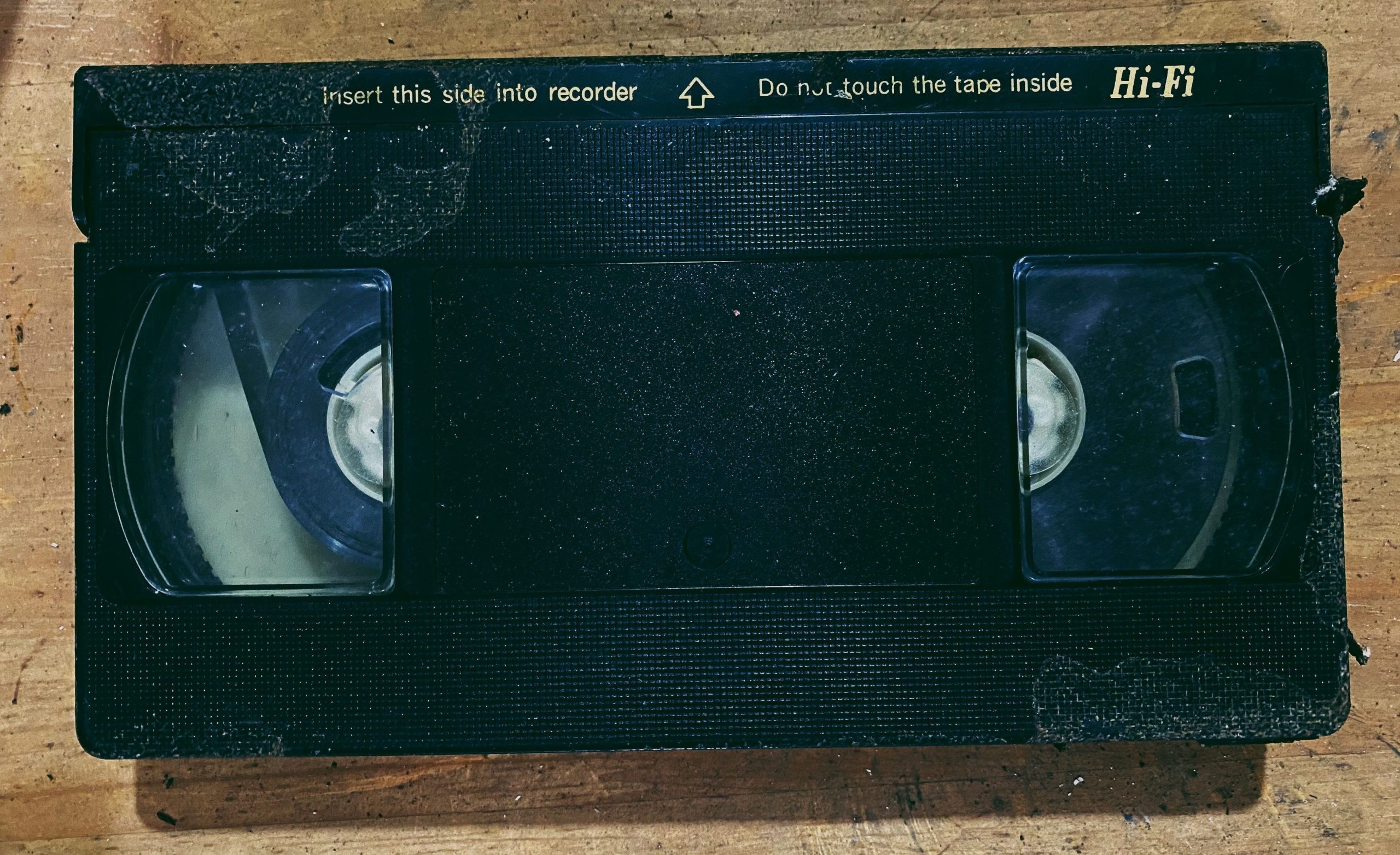 Black videocassette on table and the first item on our list of obsolete technology.