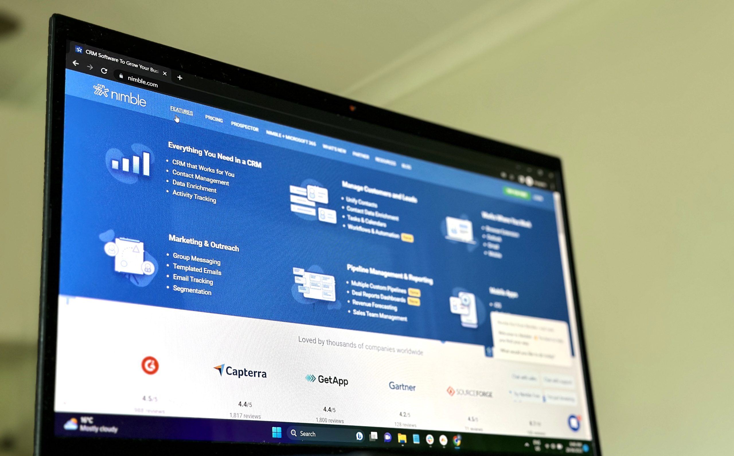 Laptop displaying the Nimble CRM homepage.