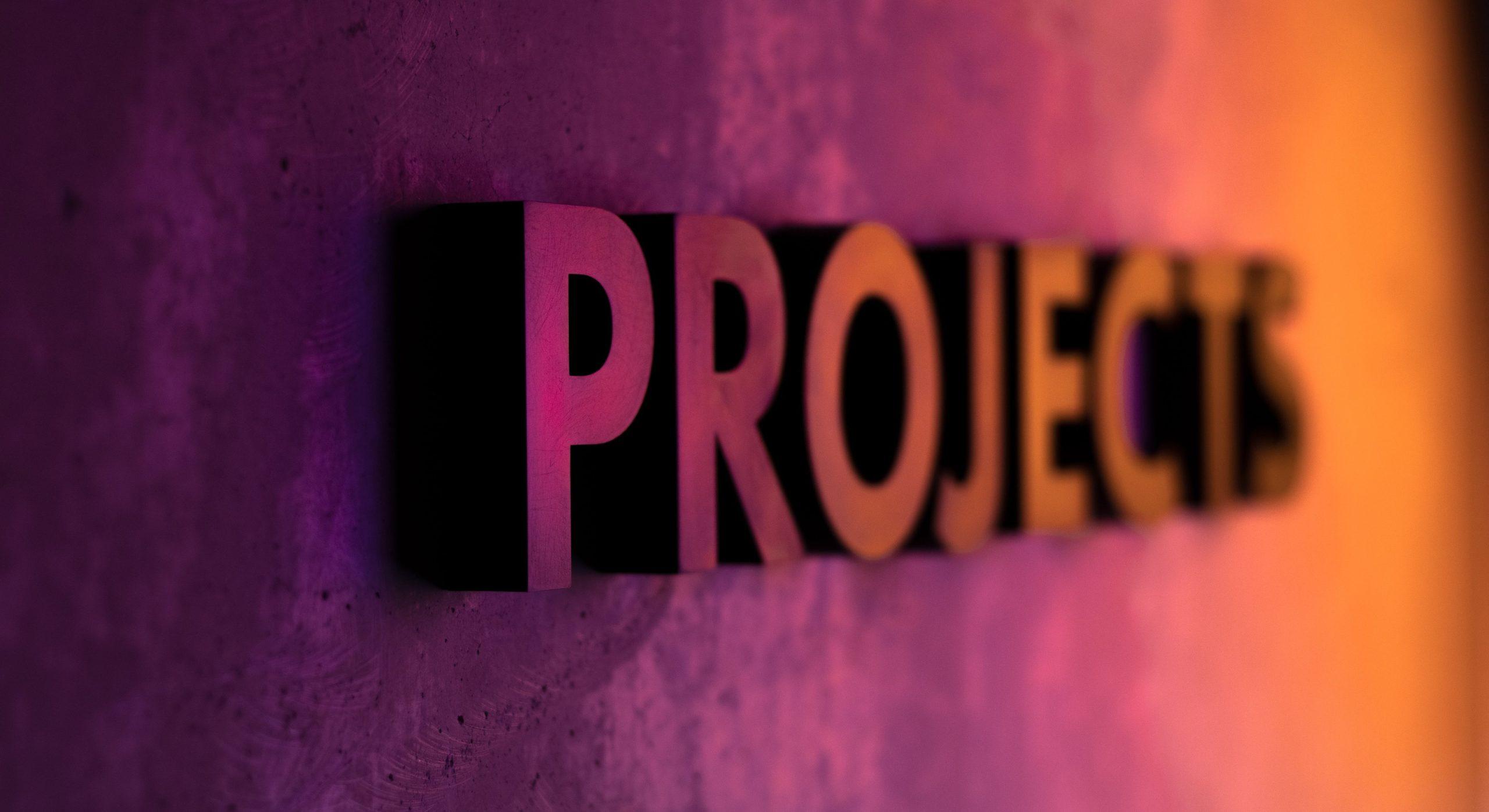 Colourful wall with the word 'PROJECTS' featured.