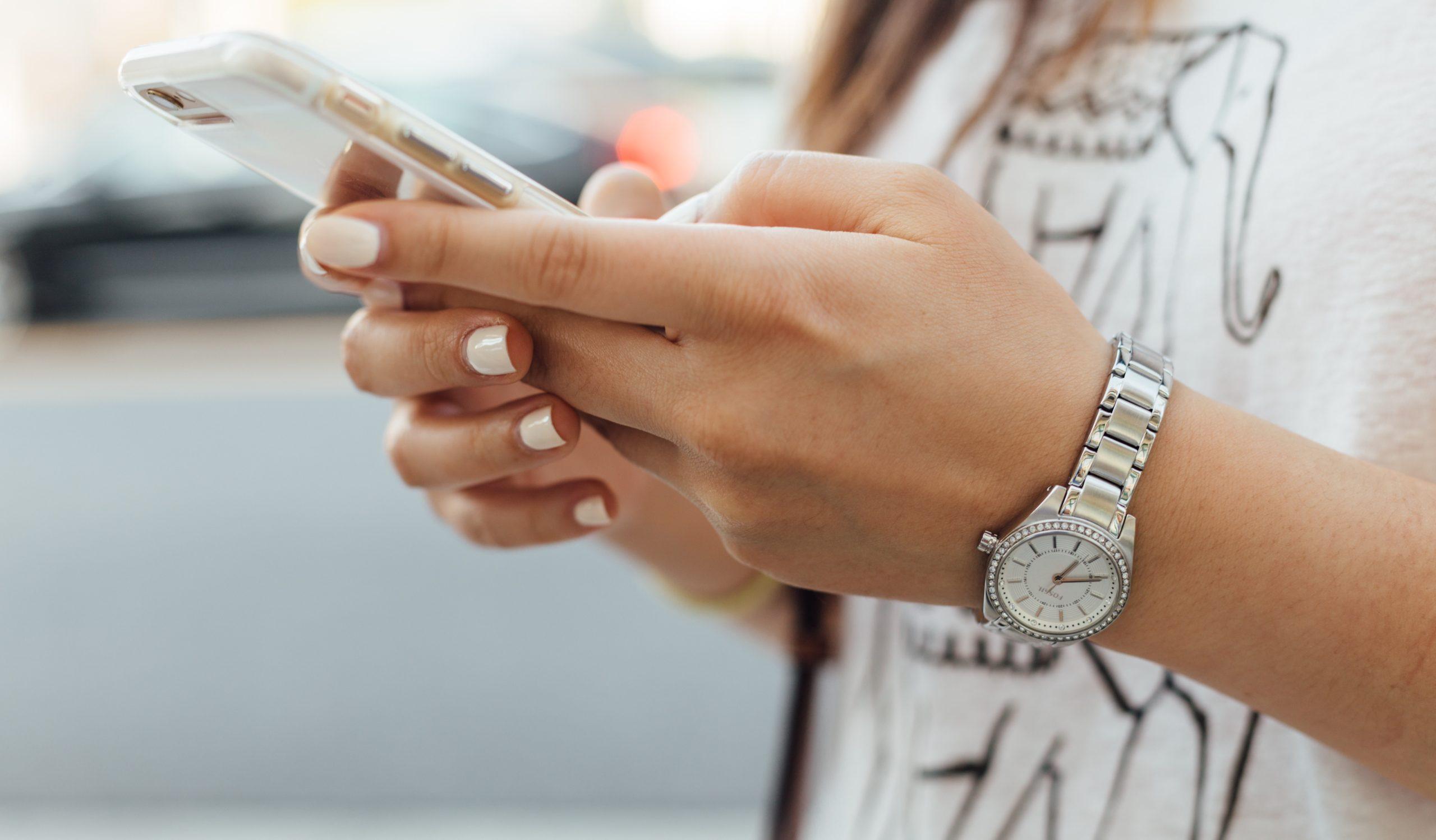 Close up of a person using a smartphone.