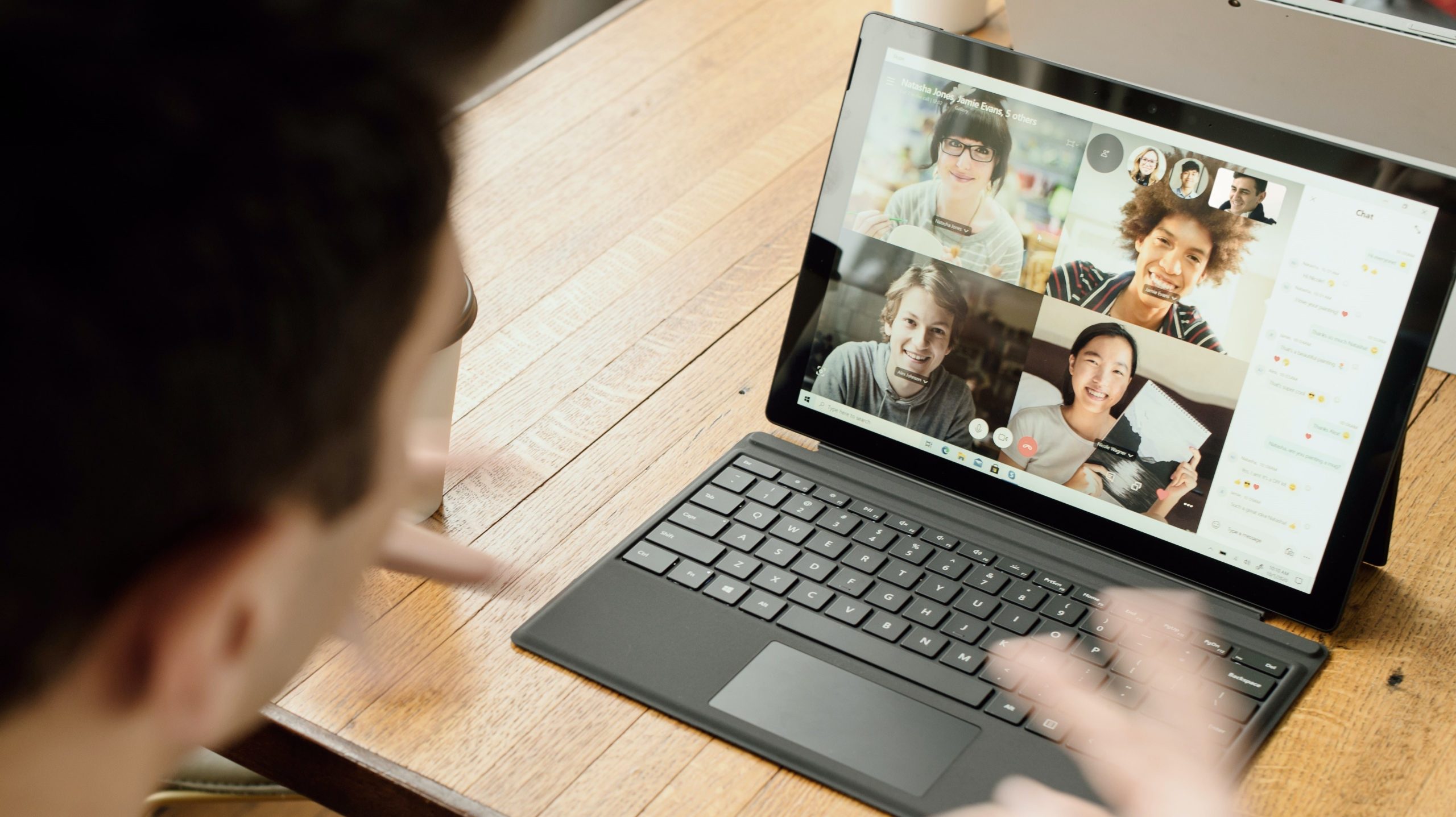 Close up of a man and a laptop during a video call.