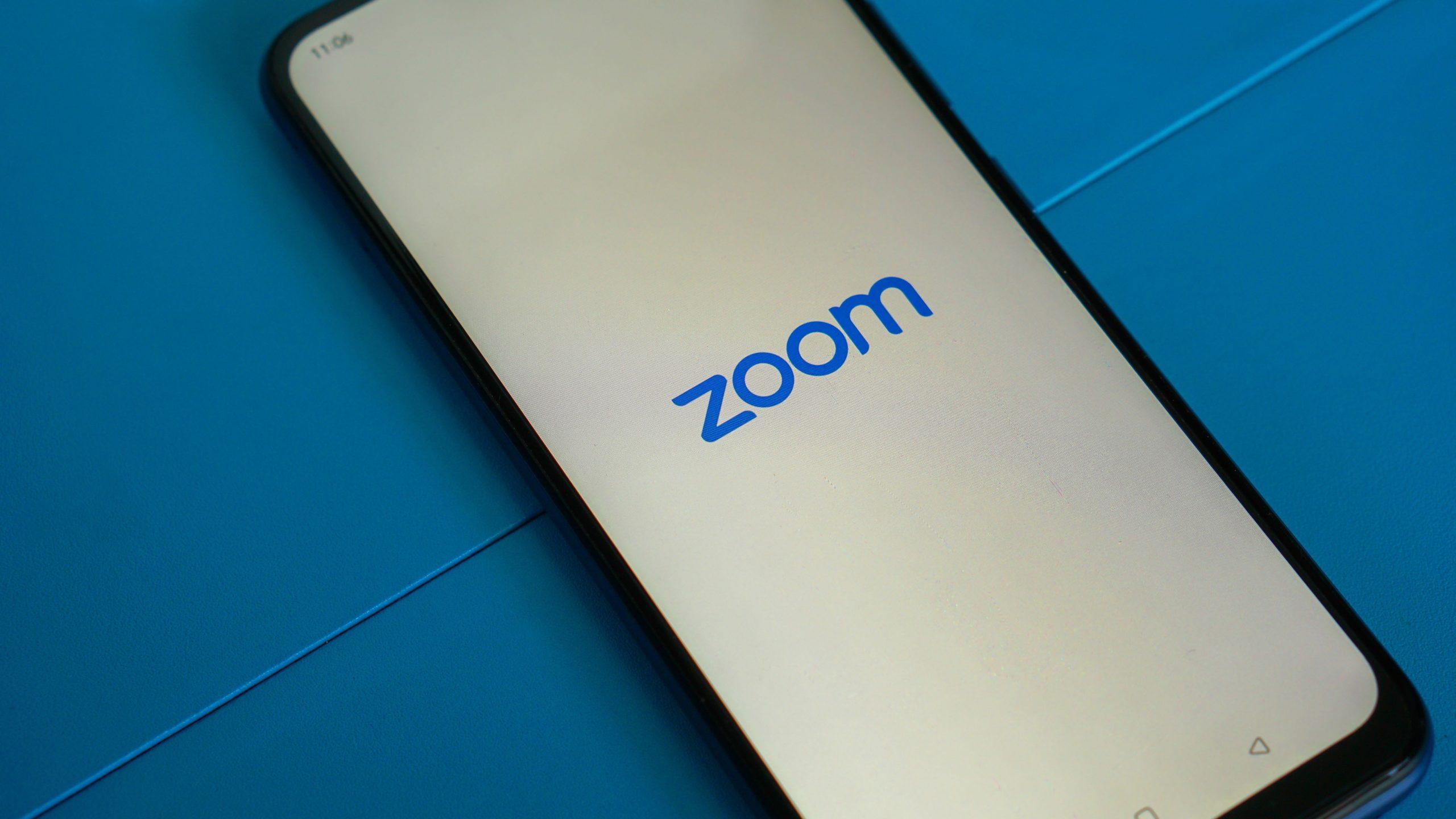 Smartphone displaying the Zoom logo.
