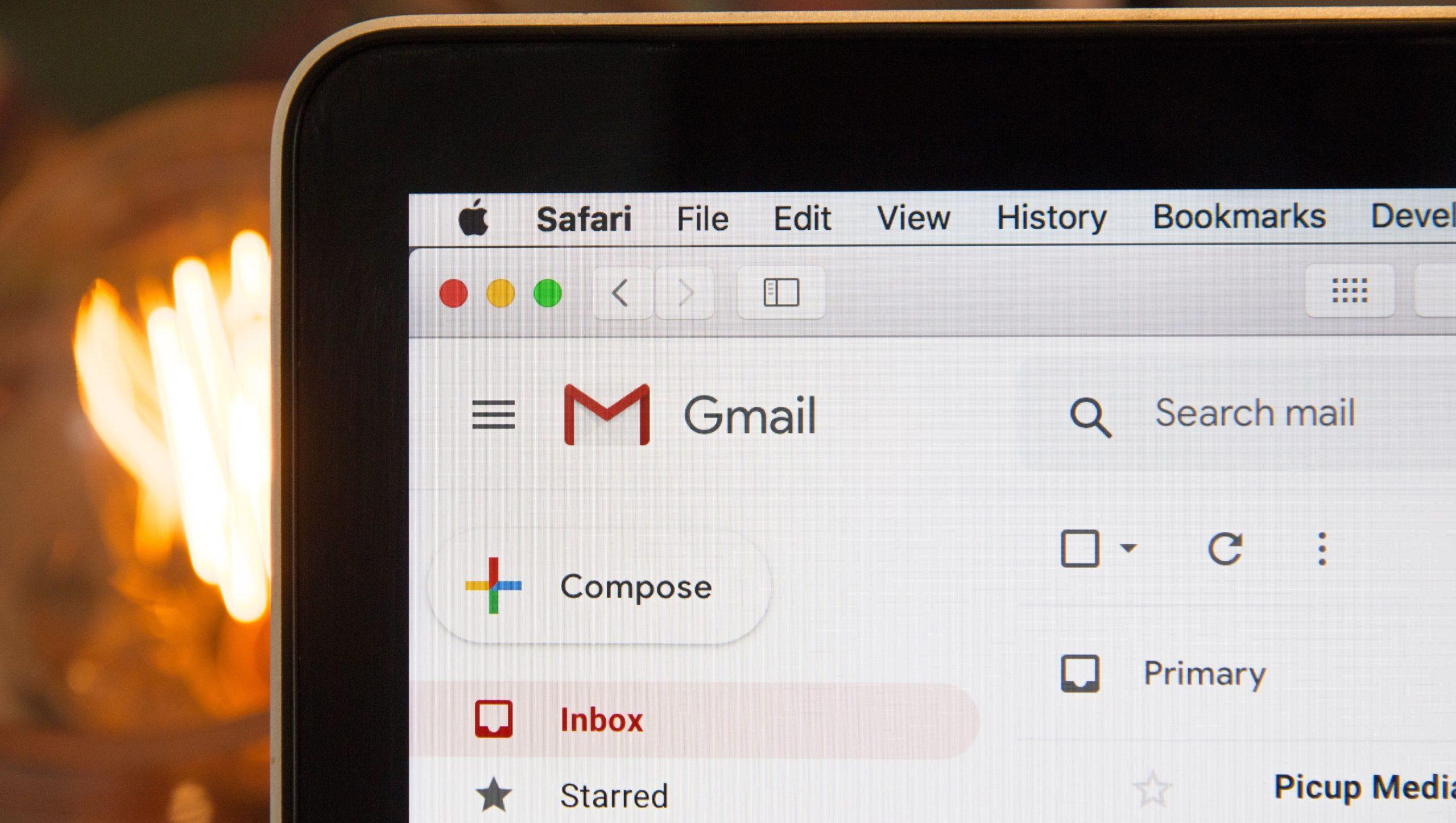 A close up of a laptop showing a Gmail inbox.
