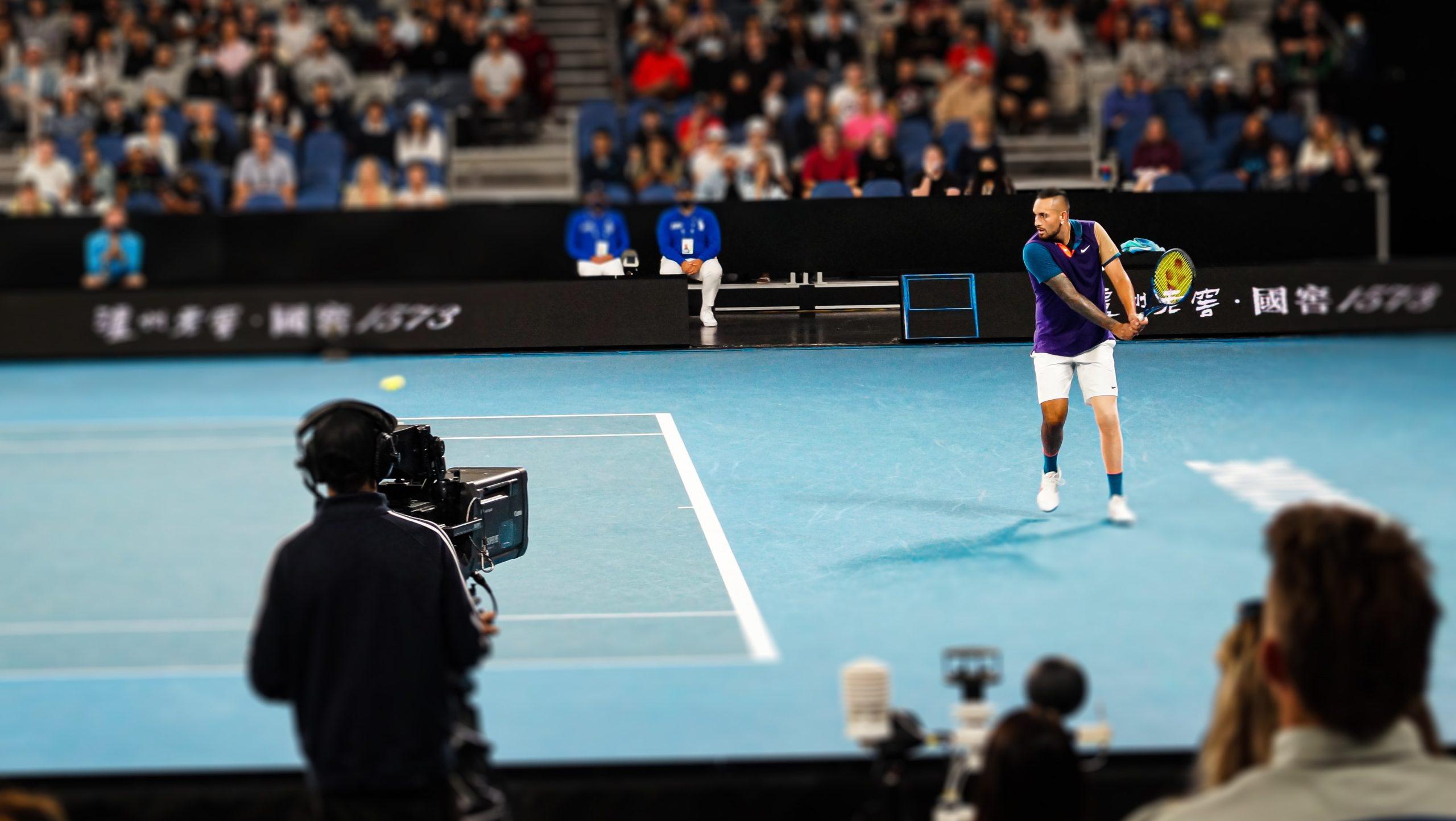 Nick Kyrgios returning a shot from Dominic Thiem in the third round of the 2021 Australian Open.