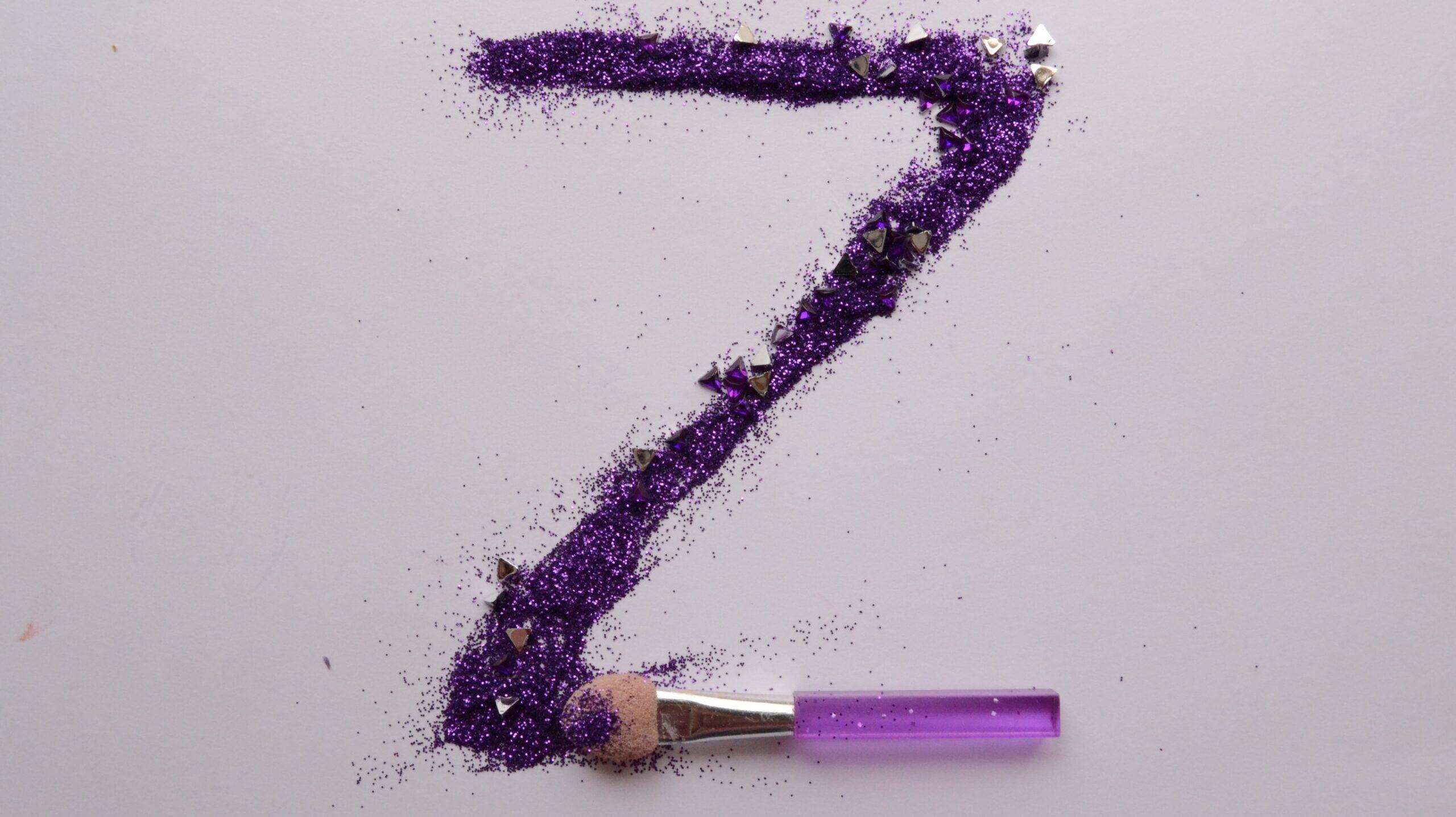 The letter 'Z' created by purple glitter. 