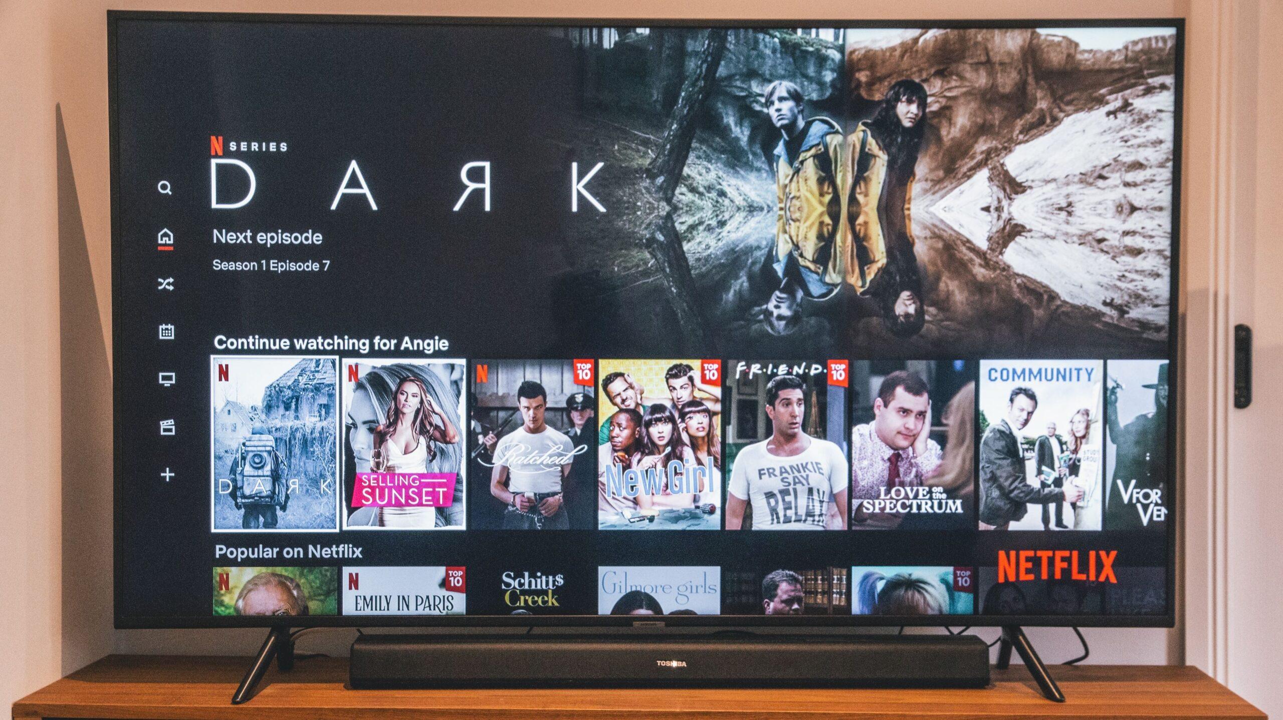 TV perched on a table displaying the Netflix homepage.