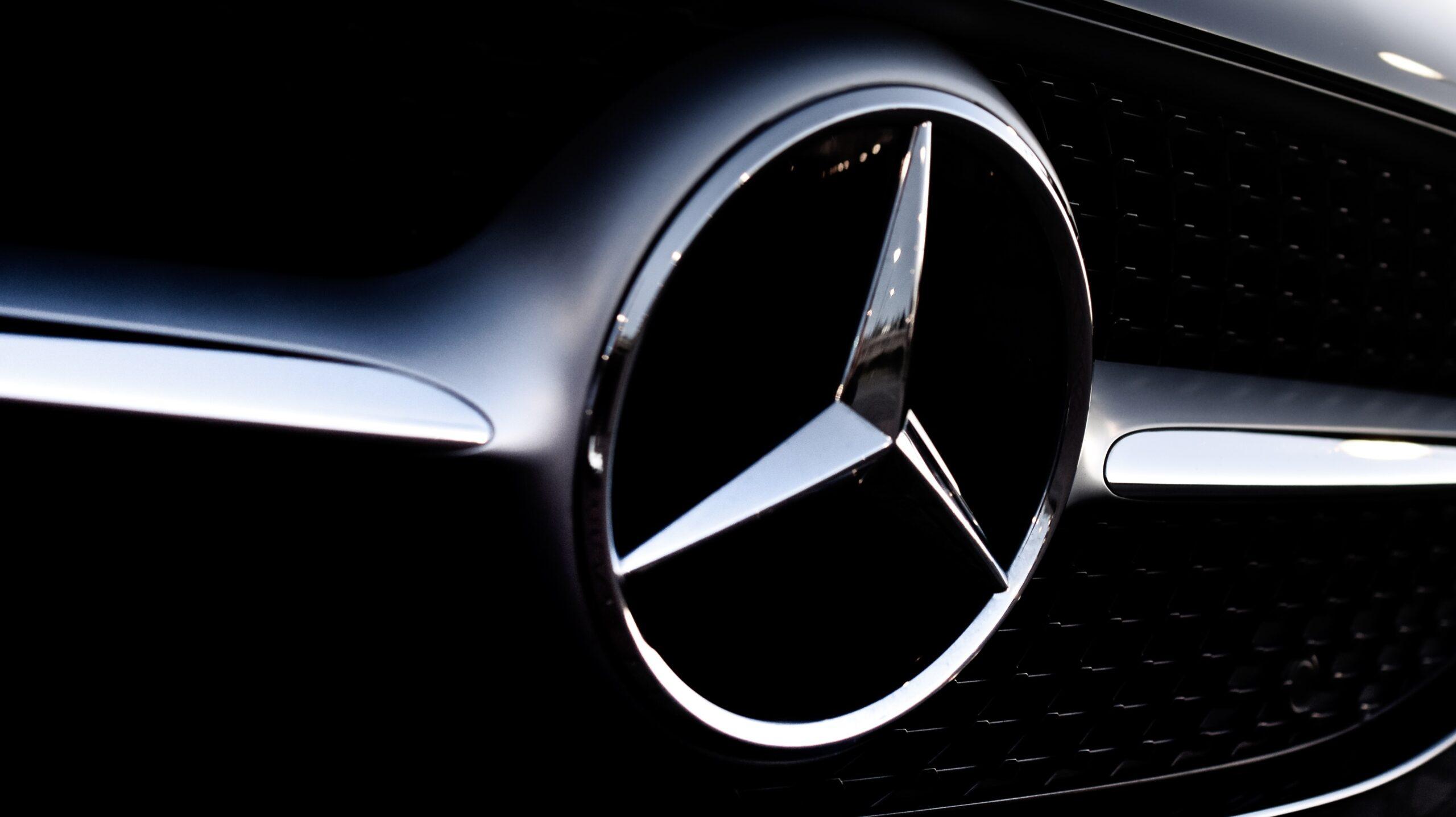 Close up of the logo on a Mercedes Benz car.