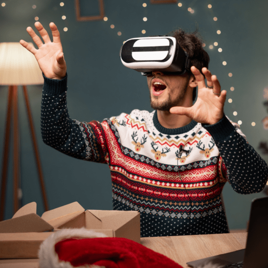 A man celebrates a virtual Christmas on a pair of VR goggles.
