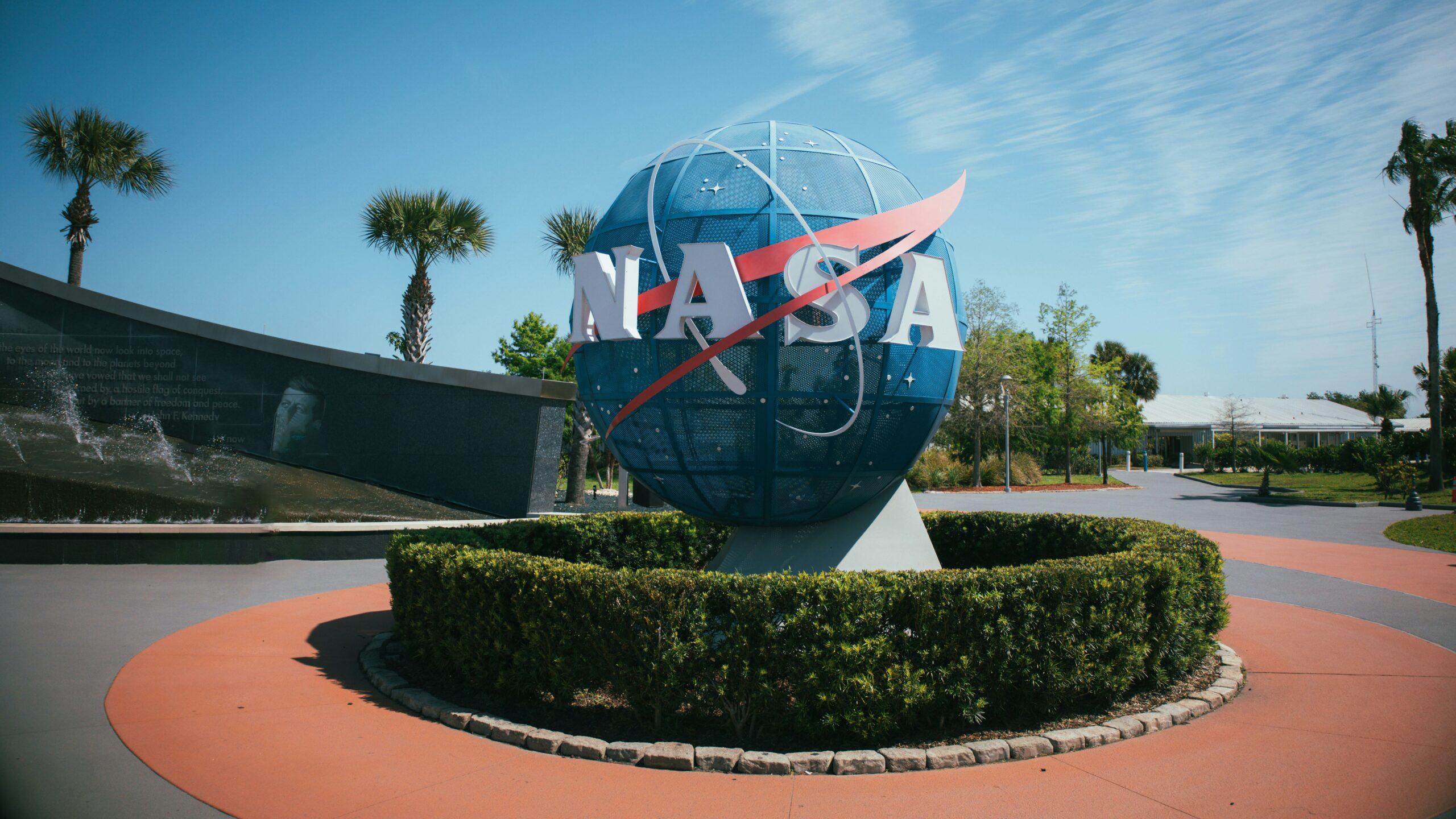 A globe object featuring the NASA logo at the Kennedy Space Center Visitor Complex in Florida, USA.