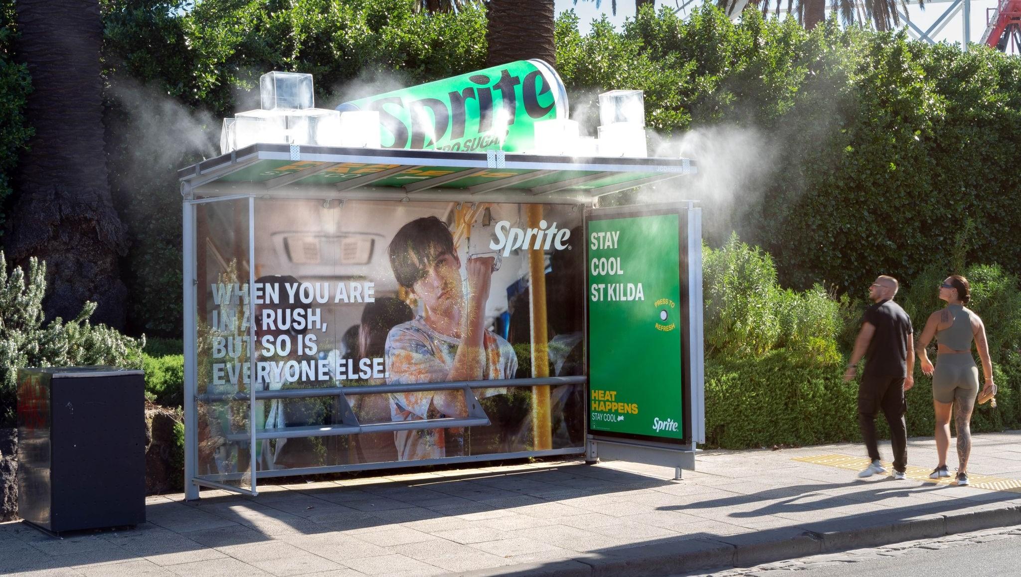 Unidentified bus stop with a Sprite can on its top spraying out mist.