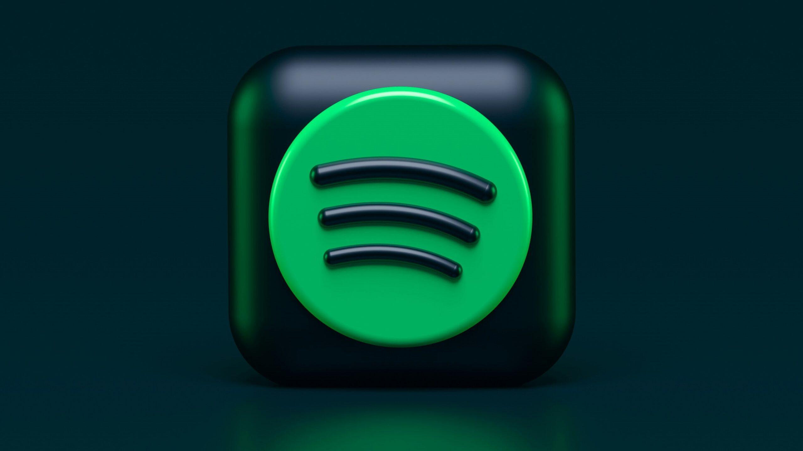 Spotify logo appearing on a cube-shaped object against a darkened background.